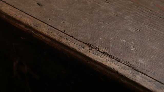 Furniture closed by hand inside ancient house footage - Details of rotten wooden chest close-up 