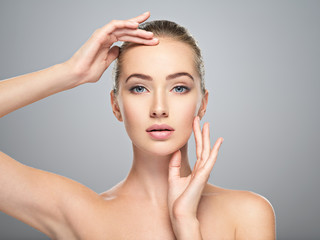 Beautiful face of young woman with perfect skin