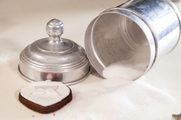 sugar and biscuits on a white table