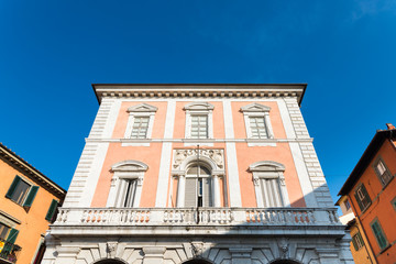 Pink building facade in Pisa, Tuscany, Italy