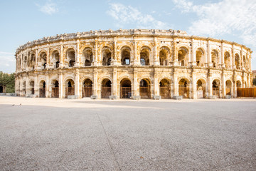 Obraz premium Morning view on the ancient Roman amphitheatre in Nimes city in the Occitanie region of southern France