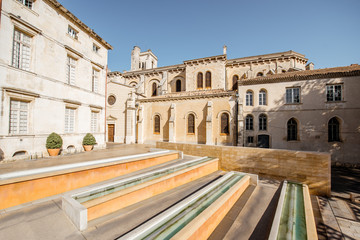 Morning view on the small square near the saint Castor cathedral in Nimes city in the Occitanie region of southern France