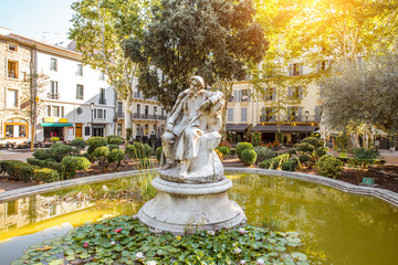 View on the small green fountain in Nimes city in the Occitanie region of southern France