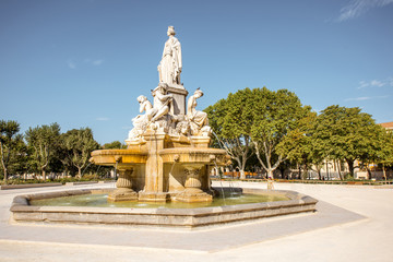 View on the Charles Gaulle fountain in Nimes city during the sunny morning in the Occitanie region of southern France