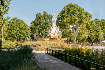 View on the Charles Gaulle fountain in Nimes city during the sunny morning in the Occitanie region of southern France