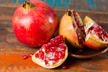 Healthy fruit red ripe pomegranate, rich of Vitamin C, also known as a symbol of prosperity, fertility and used in traditional medicine