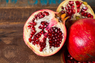 Healthy fruit red ripe pomegranate, rich of Vitamin C, also known as a symbol of prosperity, fertility and used in traditional medicine