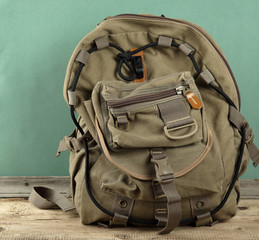 Fototapeta premium old travel backpack on the floor