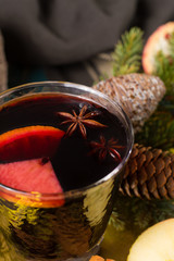Warm mulled wine for Christmas days, prepared with apple, orange and spices.