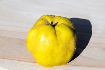 quince fruit on a wooden platter