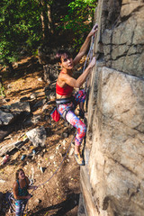 girl climber on a rock.