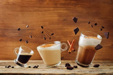 Foto op Plexiglas Different types of coffee with flying ingredients. Espresso, cappuccino and mocha coffee © nata_vkusidey