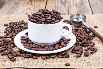 Cup full of coffee beans