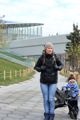 Mother with child in autumn Park