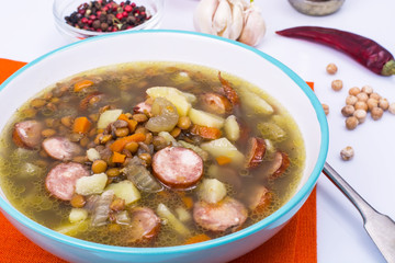 Vegetable soup with chickpeas and smoked sausages
