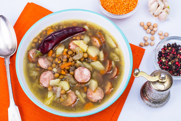 Vegetable soup with chickpeas and smoked sausages