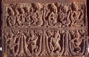 Example of Indian art carvings with life of ancient people and gods at 7th century temples in Pattadakal, India.