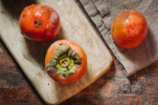 Fresh raw kaki fruits