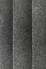Fototapeta premium Top view of gray gravel stairs. background texture
