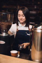 Barista at work preparing coffee