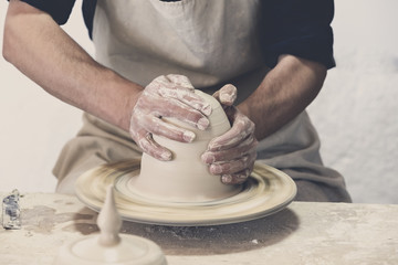 Potter makes pottery handmade in the workshop 
