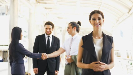 Beautiful Businesswomen Portrait with coworkers in background