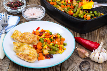 Stewed vegetables with pieces of meat in breading for dinner