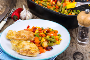 Stewed vegetables with pieces of meat in breading for dinner