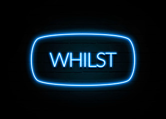 Whilst  - colorful Neon Sign on brickwall