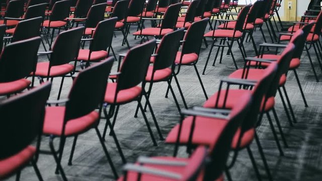 empty red seating vacant place rows seats chairs nobody meeting room conference hall public educational urban space training business company congress event trendy equipment furniture workshop stools