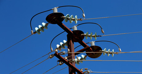power line with electrical pole in the clear sky