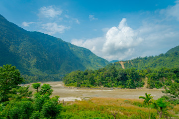 Fototapeta na wymiar Beautiful landscape view, with a river and vegetation in the mountains of Pokhara Kathmandu, Nepal