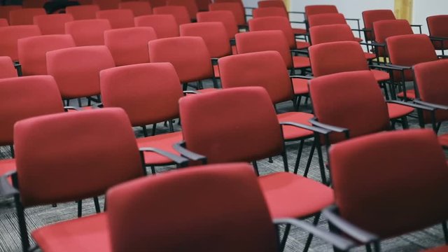 empty red chairs seats big hall neat rows stools vacant places seat sitting place audience organizing free public open business seminar meeting room conference nobody indoor perspective interior