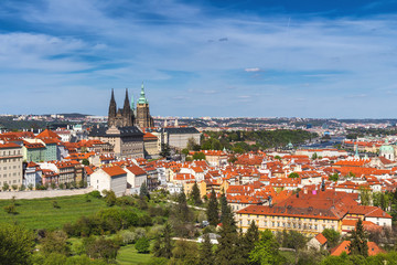 Naklejka na ściany i meble Skyline aerial view of Prague old town, Charles bridge, Prague Castle and St Vitus Cathedral and red roofs. Prague, Czech republic.