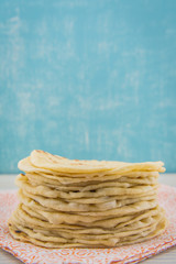 Stack of Homemade Tortillas on Orange Napkin