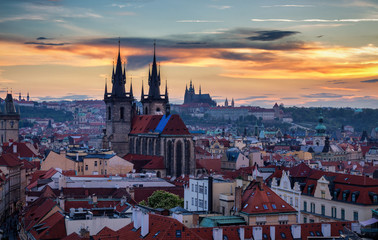 Fototapeta premium Aerial view over Church of Our Lady before Tyn, Old Town and Prague Castle at sunset in Prague, Czech Republic
