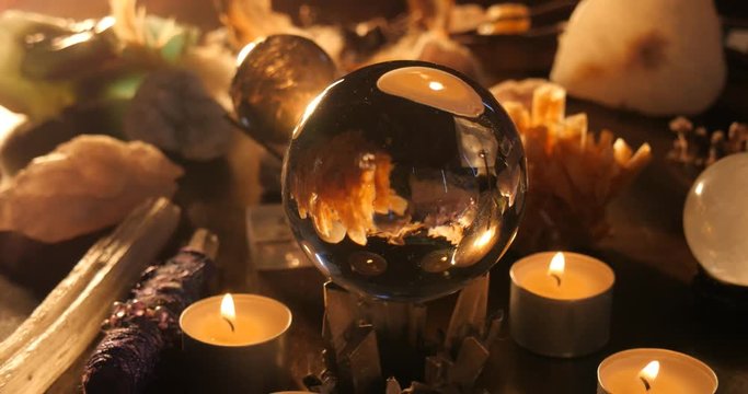 Voodoo conjurer occult mystic table reading setup with crystals