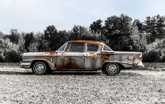 Circa 1957 old rusted vintage Studebaker 2 door car on the side of a road in Holden, Maine. Taken July 2017	