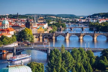 Fototapeten Scenic spring sunset aerial view of the Old Town pier architecture and Charles Bridge over Vltava river in Prague, Czech Republic © daliu