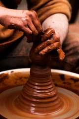 Potter hands jug