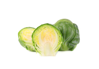Fototapeta premium Brussels sprouts isolated on a white background. Pile of Brussels sprouts