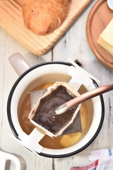 Instant freshly brewed cup of coffee on a wooden table