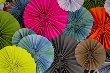 Recycled paper folding umbrella, with multi color, are decorated as background or backdrop.