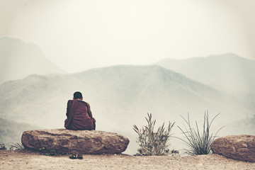 The monks are meditating on the mountain.