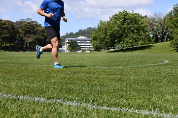 Man runs on green grass