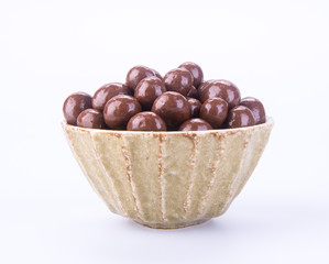chocolate balls. chocolate balls in bowl on a background