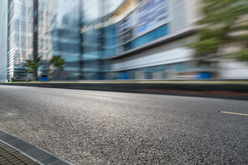 empty asphalt road front of modern buildings.