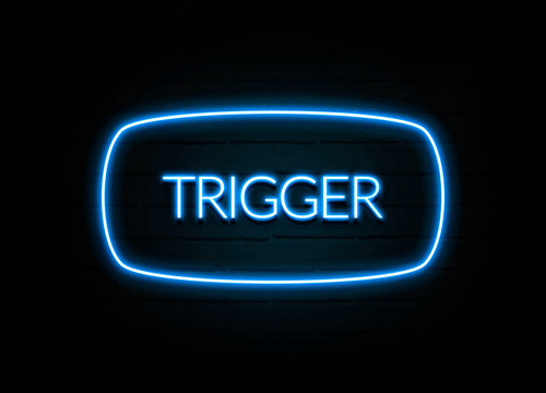 Trigger  - colorful Neon Sign on brickwall