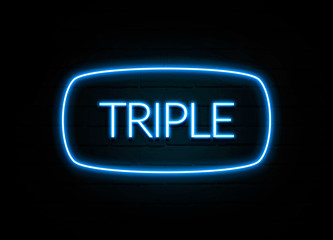 Triple  - colorful Neon Sign on brickwall
