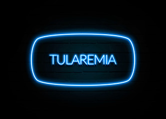 Tularemia  - colorful Neon Sign on brickwall